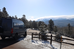 Mueller-Adventure-Wagon-Wide-in-parking-with-mtns