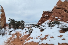 Arches-in-Winter-Snow-Piles-on-Rocks