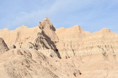 Badlands-Castle-Trail-queen-looking-over-rock