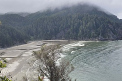 Cape-Falcon-first-look-at-beach-and-cloudy-cliff