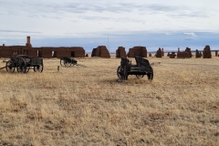 Hiking-Fort-Union-old-Wagons-in-field