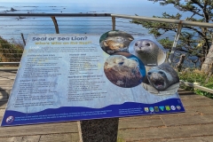 Simpson-reef-from-shore-acres-overlook-seal-sign